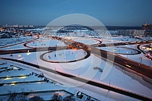 Evening winter cityscape with big interchange