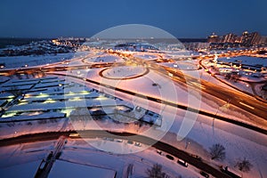 Evening winter cityscape with big interchange