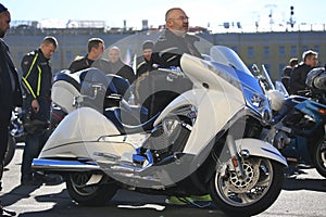 White motorcycle Victory Vision Tour and its owner