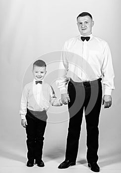 Event manager. male fashion. parenting. fathers day. small boy with dad businessman. family day. father and son in