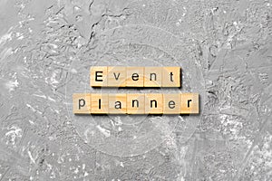 EVENT PLANNER word written on wood block. EVENT PLANNER text on cement table for your desing, concept