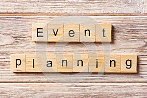 Event planning word written on wood block. Event planning text on table, concept