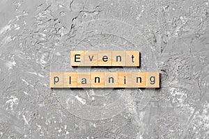 Event planning word written on wood block. Event planning text on table, concept