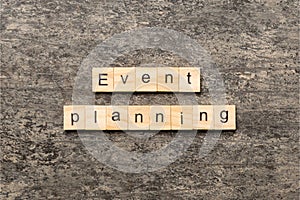 Event planning word written on wood block. Event planning text on table, concept