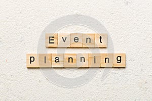 Event planning word written on wood block. Event planning text on table, concept