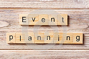 Event planning word written on wood block. Event planning text on table, concept