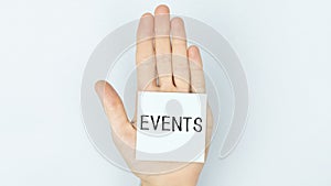 Events text on paper in hand, business