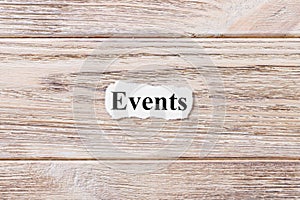 Events of the word on paper. concept. Words of Events on a wooden background