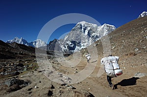 Everest trek, Porters are carrying extremely big load, Nepal