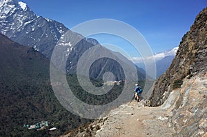 Everest trek, Tourist hiking on Pangboche - Portse upper trail with view of Deboche and Tengboche villages. Mountains Himalayas photo