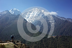 Everest trek, Tourist is standing on Pangboche - Portse upper trail with view of Tengboche village. Mountains Himalayas