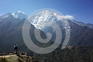 Everest trek, Tourist is standing on Pangboche - Portse upper trail with view of Tengboche village. Mountains Himalayas photo