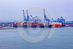 Evergreen container ship with full of cargo docked in port