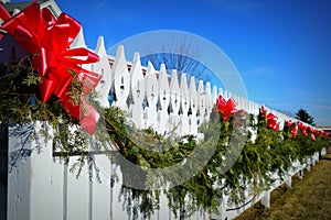 Evergreen Swag on White Picket Fence