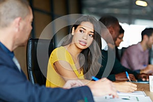 Every accomplishment starts with the decision to try. a group of colleagues having a meeting in a boardroom.