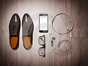 Every day carry man items collection: glasses, leash, shoes .