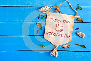 Every day is a new beginning text on Paper Scroll photo