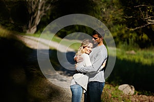 Every day is perfect with you. an affectionate young couple hugging in a park.