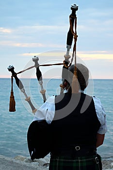 Female Bagpiper at Station Beach, Kincardine, Ontario on Tuesday, July 31,2018