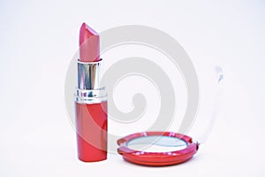 Every girl needs beauty products. Cosmetics and beauty care concept. Lipstick and eyeshadows close up white background