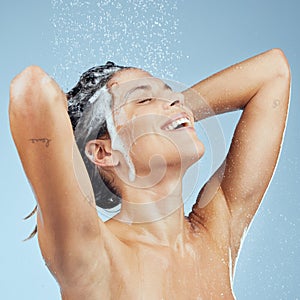 Every good day starts with a refreshing shower. Studio shot of an attractive young woman washing her hair while taking a