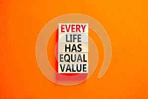 Every life has equal value symbol. Concept words Every life has equal value on wooden blocks. Beautiful orange table orange