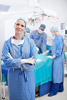 Every life is worth saving. Portrait of a serious female surgeon standing in an operating theatre.