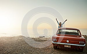 Every moment out here is one to savor. a young woman enjoying a road trip along the coast.