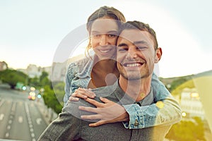 Every moment together is special. a happy young couple enjoying a piggyback ride in the city.