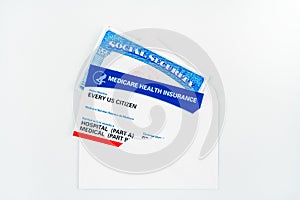 Every us citizen text on blank medicare health card with social security card in envelope