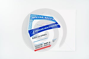 Every us citizen text on blank USA medicare health card with social security card in envelope