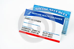 Every us citizen text on Medicare health insurance card and social security card isolated on white