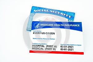 Every us citizen text on Medicare health insurance card and social security card isolated on white