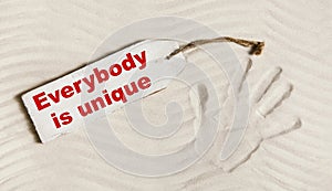 Everybody is unique: Hand print with text for mental and individ photo
