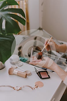 Everyday beauty routine. Make up artist. Dressing vanity. Women& x27;s hands. Pastel colors. In front of the mirror. Palettes