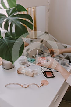 Everyday beauty routine. Make up artist. Dressing vanity. Women& x27;s hands. Pastel colors. In front of the mirror. Palettes