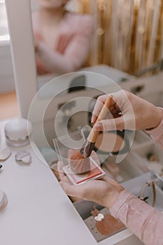 Everyday beauty routine. Make up artist. Dressing vanity. Women& x27;s hands. Pastel colors. In front of the mirror. Palettes