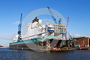 Shipyard with ship for repair in dry dock in the port of Bremerhaven, Germany