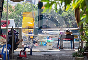 Everyday Life in Vietnam. A sleeping man in a hammock .