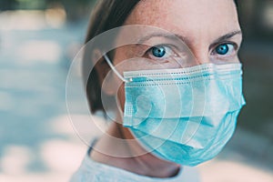 Everyday people with protective face mask during coronavirus pandemics photo