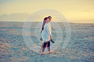 Everyday should be beach day. a mature couple going for a relaxing walk on the beach.