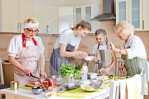 everyone is busy with preparing ingredients for pizza, family members in kitchen