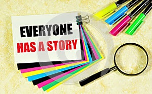 Everyone has a story. Lettering on multicolored stickers.