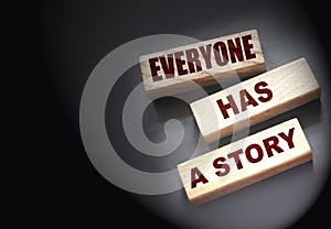 Everyone Has a Story word written on wood block. Storytelling copywriting business concept