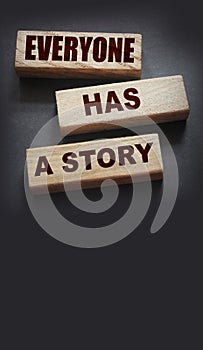 Everyone Has a Story word written on wood block. Storytelling copywriting business concept