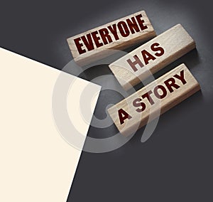 Everyone Has a Story word written on wood block. Storytelling copywriting business concept