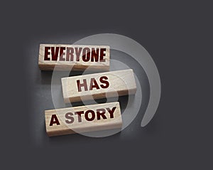 Everyone Has a Story word written on wood block. Storytelling copywriting business concept