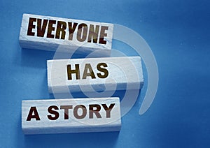 Everyone Has a Story word written on wood block. Storytelling copywriting business concept