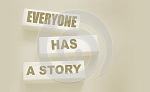 Everyone Has a Story word written on wood block. Storytelling copywriting business concept