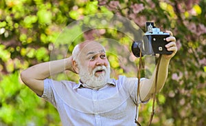 Everyone photogenic. Senior man taking selfie photo vintage camera. Self portrait. Memories in snap. Retro equipment for
